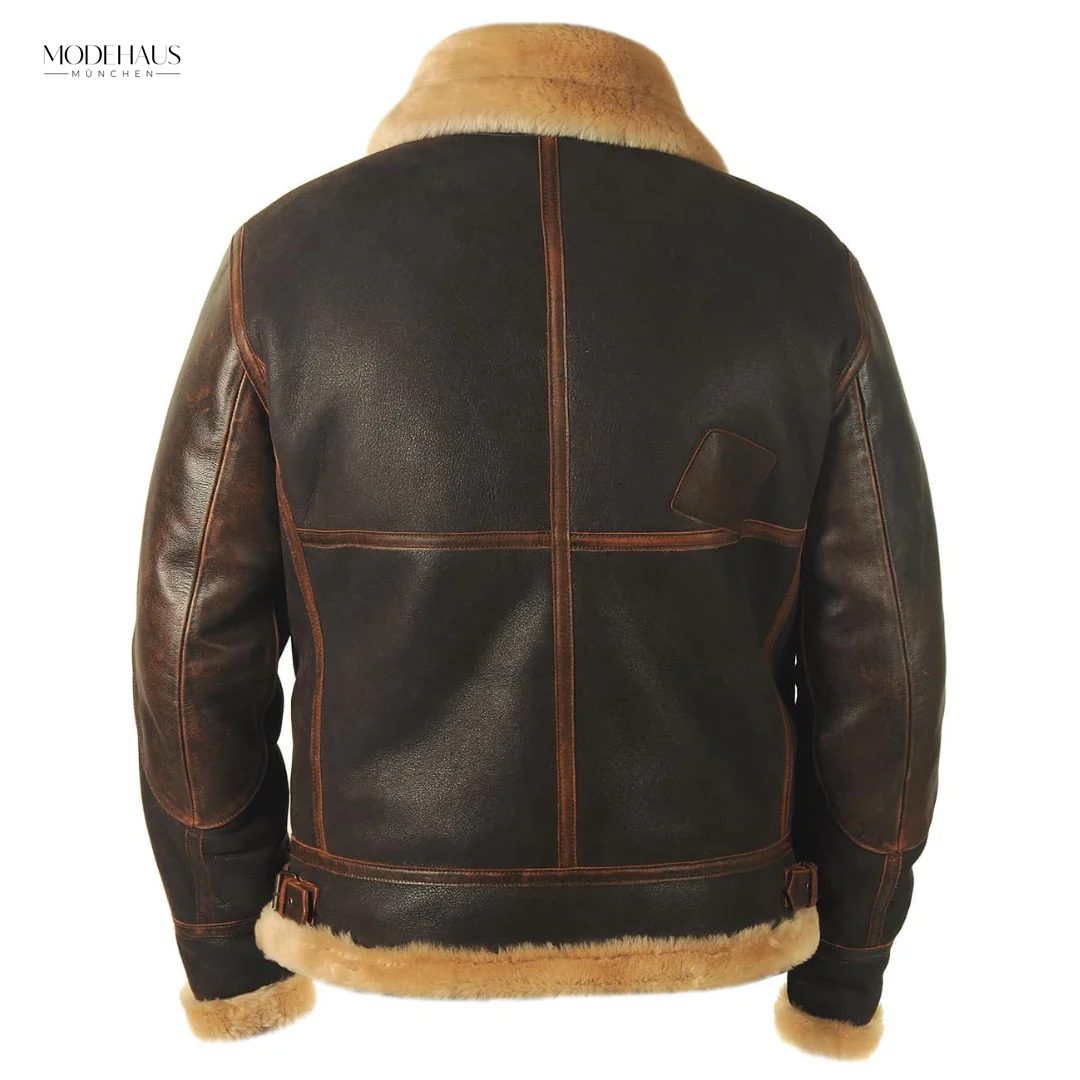 Dunkelbraune Lammfell-Fliegerjacke mit beigem Kragen und Ziernähten, Rückenansicht.