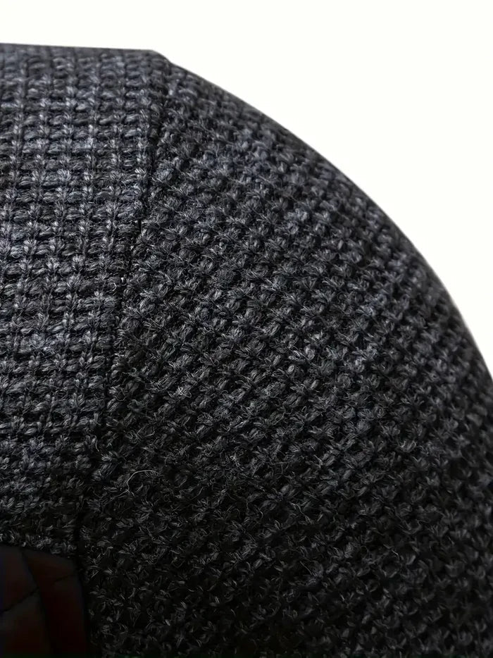 Detailaufnahme schwarze Strickstruktur eines Kleidungsstücks, Nahaufnahme Textil