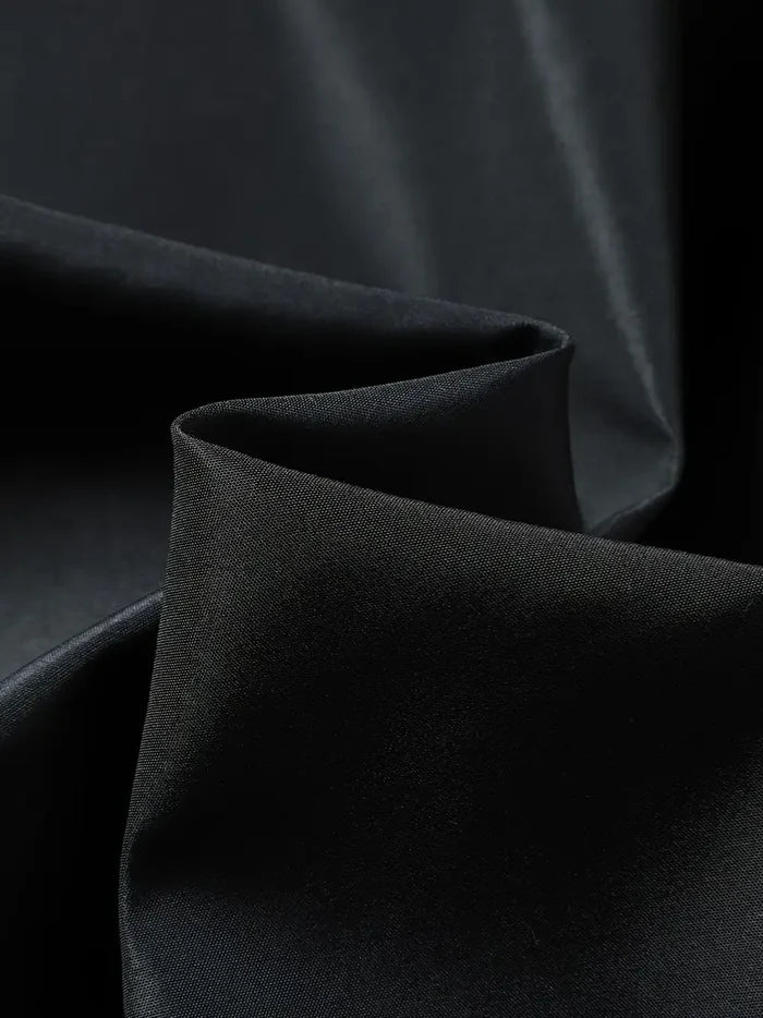 Nahaufnahme schwarzer Stoff, glatter Textilstoff, Fleecejacke Material Detail